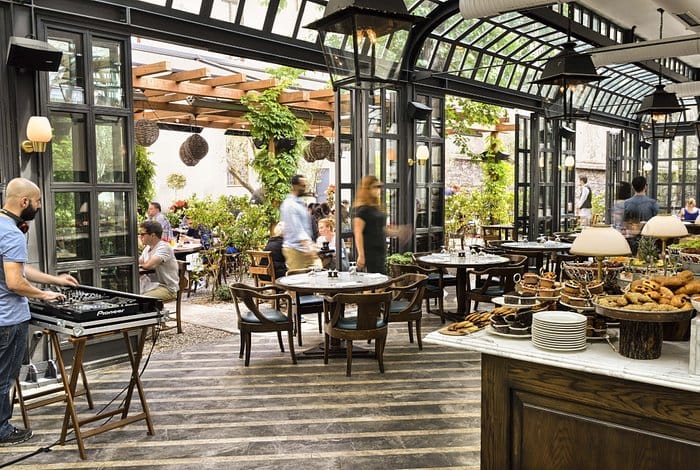 Upscale Mezzanine event space with buffet for corporate brunch and networking mixer.