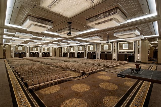 Theater-style ballroom at T Lounge conference center for corporate events and plenary meetings.