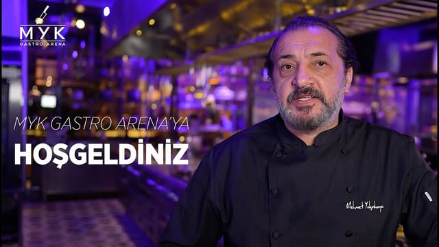 Executive chef in MYK Gastro Arena kitchen for immersive culinary event and F&B experience.