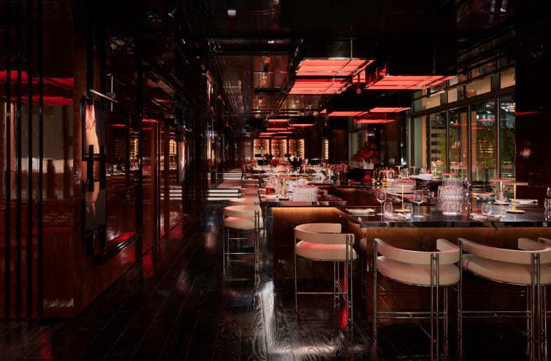 Upscale Frankie bar interior with mood lighting for VIP cocktail hours and networking events.