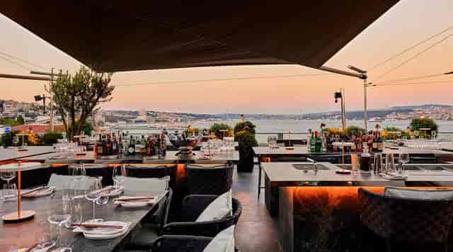 Sophisticated waterfront bar setup for corporate cocktail reception and networking event.