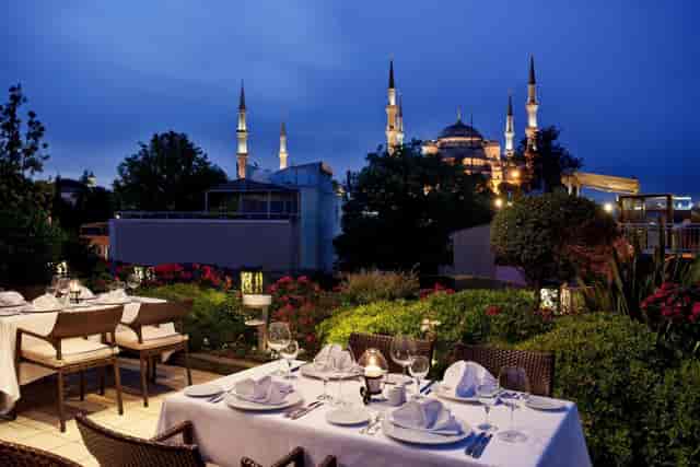 Rooftop gala at Mosaic Terrace Restaurant, Istanbul, featuring iconic Blue Mosque view.