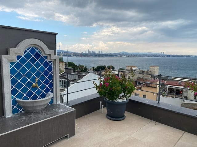 Rooftop cocktail reception at Henna Terrace with scenic waterfront views for event venue rental.