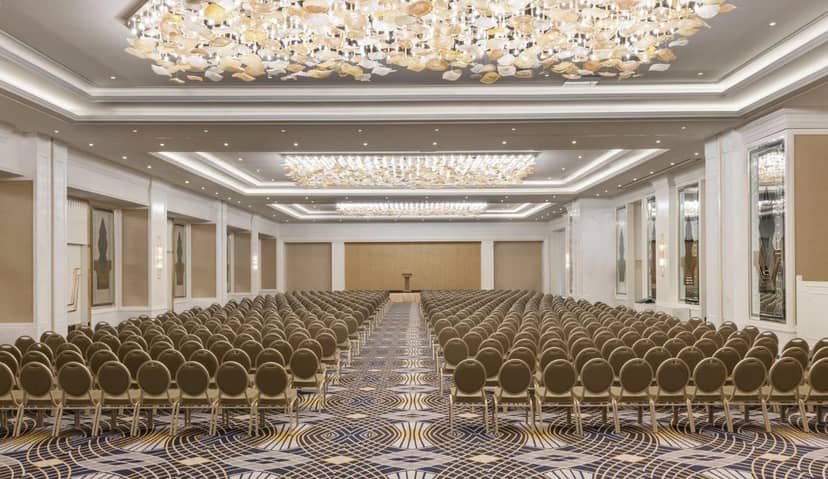Theater-style WTC Istanbul ballroom with statement chandeliers for corporate events and conferences.