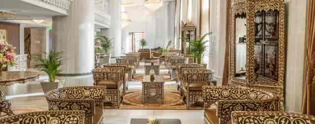 Luxury AJWA Hotel suite foyer with ornate decor for VIP networking and corporate event spaces.
