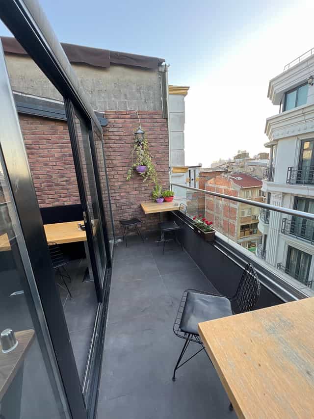 Modern Istanbul hotel terrace with industrial brick for private networking and corporate events.