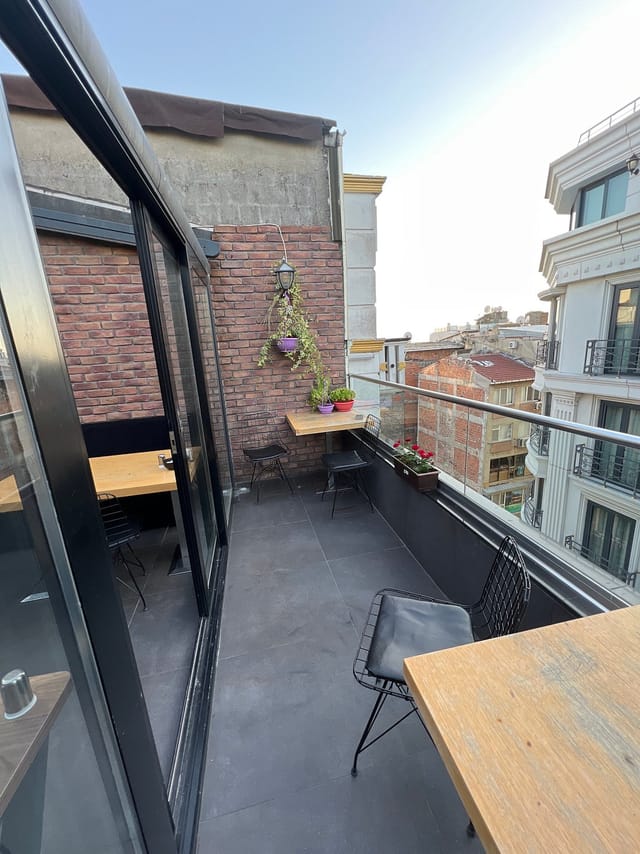Modern Istanbul hotel terrace with industrial brick for private networking and corporate events.