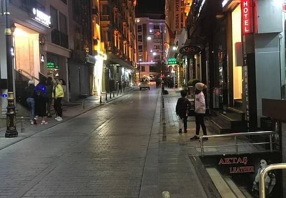 Boutique hotel street in Istanbul at night for off-site networking and city events.