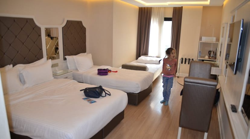 Triple-occupancy hotel room at Miss Istanbul Spa, ideal for budget business travel accommodations.