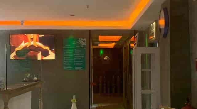 Legacy Ottoman Hotel spa entrance, dim interior, corporate event venue, business meeting space.