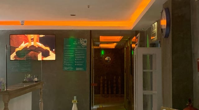 Legacy Ottoman Hotel spa entrance, dim interior, corporate event venue, business meeting space.