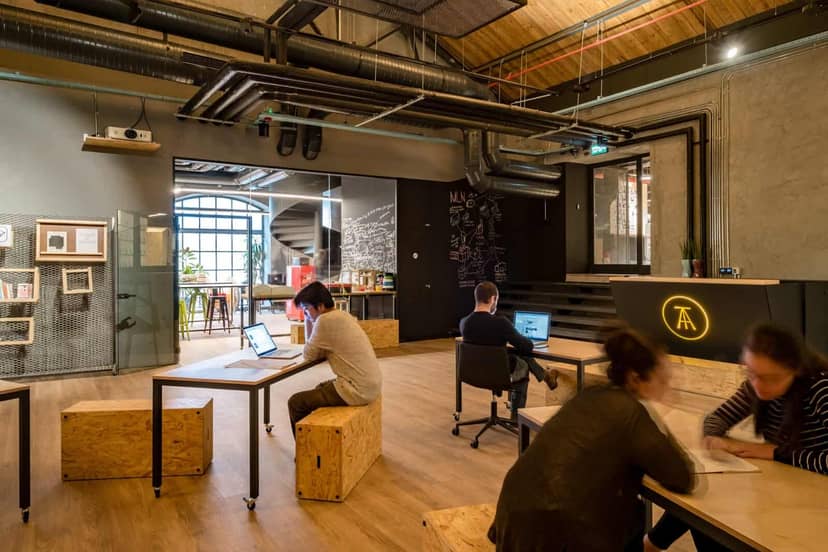 Industrial-chic private office for creative workshops and coworking sessions.
