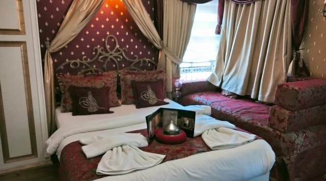 Luxury boutique hotel suite with maximalist decor for themed incentive trips and group retreats.