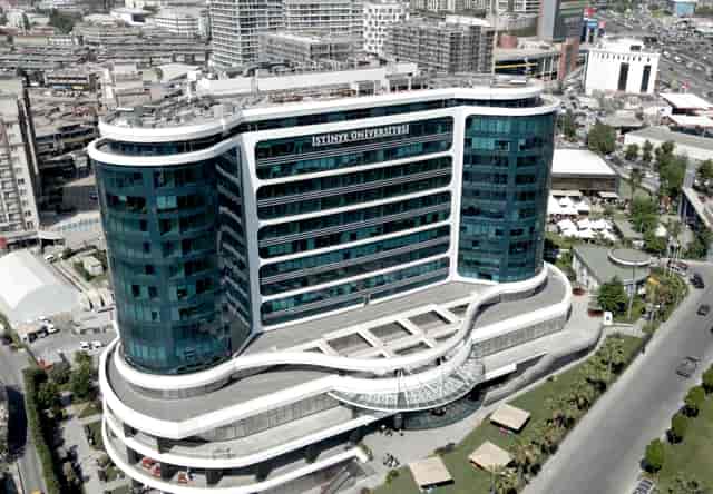 Modern Istinye Campus conference hall with large atrium for academic and corporate events.