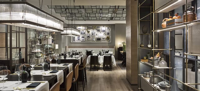 Upscale Demlique restaurant interior with ambient lighting for corporate dinners and networking.