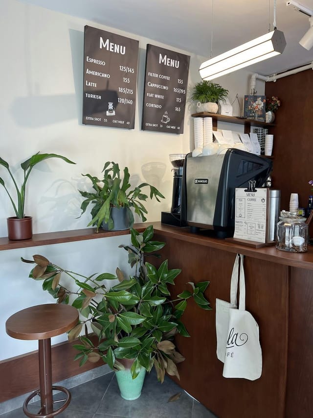 Professional coffee station setup for corporate events and breakout areas with biophilic design.