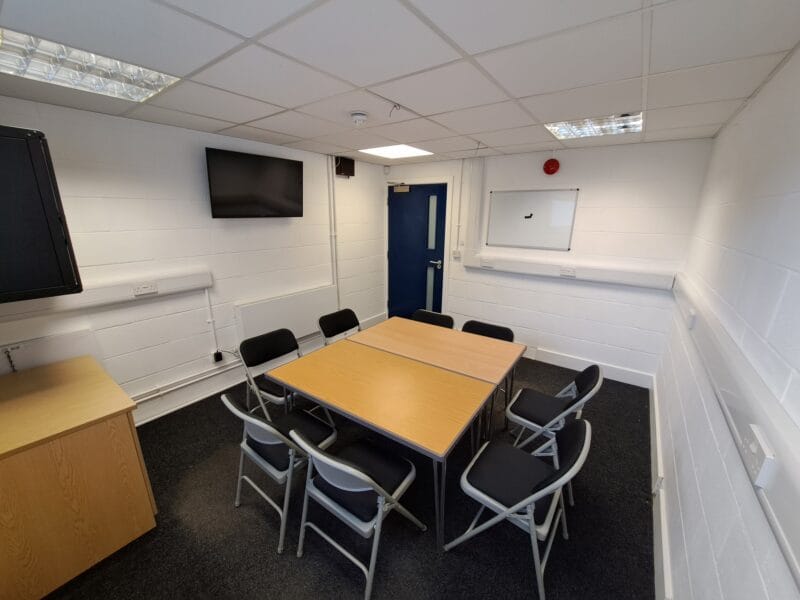 Functional breakout room at Brentwood Theatre with AV tools for small group workshops and meetings.
