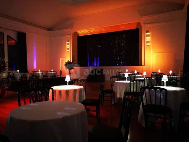 Le Solaris event space with stage and mood lighting for gala dinners or cocktail receptions.