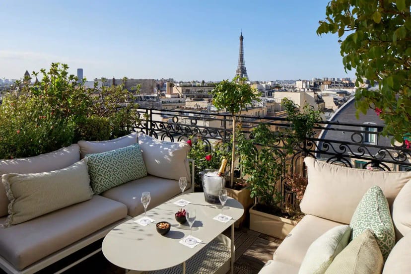 Paris rooftop lounge for luxury VIP reception and executive networking with iconic city views.