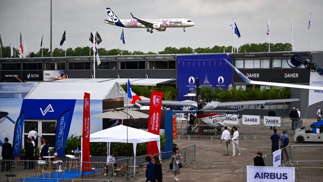 Outdoor display structures at Paris Air Show, featuring experiential brand activation trade booths.
