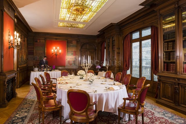 Opulent wood-paneled Salon Bibliothèque dining room, ideal for board meetings and executive lunches.