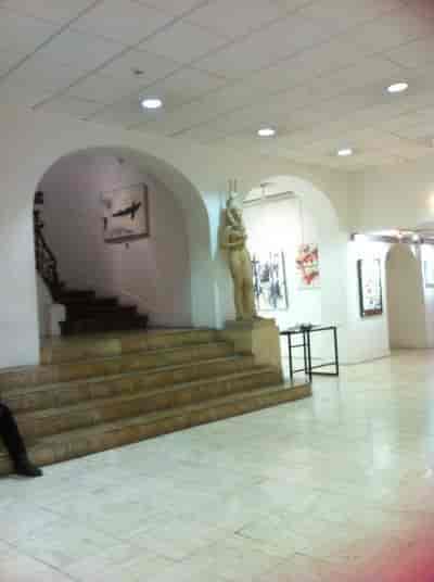 Galerie de Peinture lobby with historic staircase for intimate wedding and corporate reception.