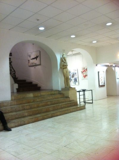 Galerie de Peinture lobby with historic staircase for intimate wedding and corporate reception.