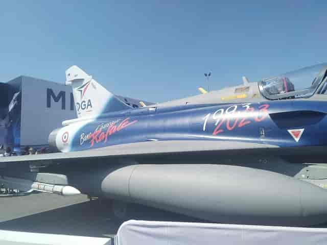 Branded Rafale jet centerpiece at Paris Le Bourget trade show for experiential marketing.