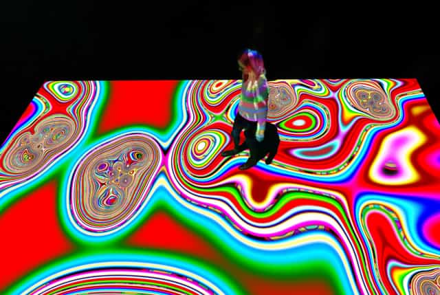 Interactive floor projection at Grand Palais Immersif for experiential event engagement.