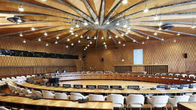 Cité de l'architecture auditorium with tiered seating for formal plenary conference sessions.