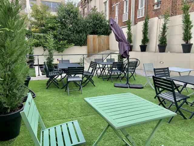 Salon Piste outdoor terrace with seating for corporate breakout sessions and networking events.