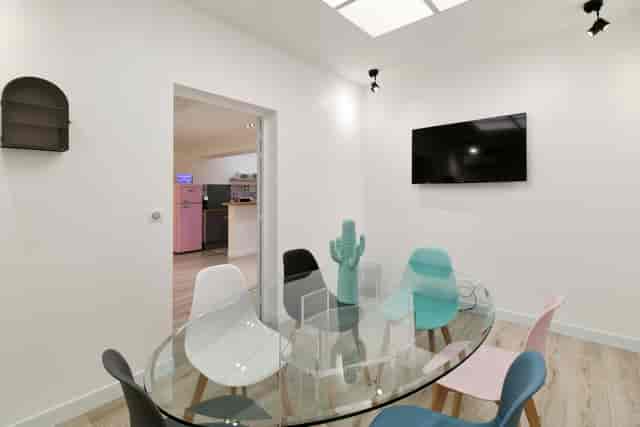 Salon Ring breakout room with glass table for creative team huddles and brainstorming sessions.