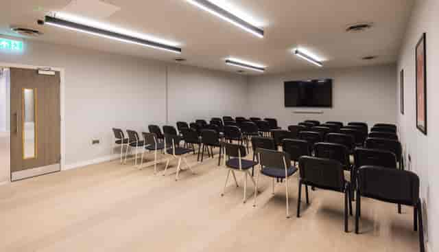 The Studio meeting room featuring theater-style seating for corporate training and workshops.