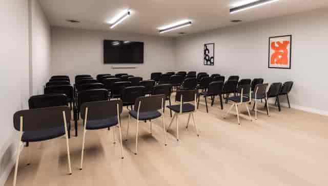 Minimalist theater-style breakout room at The Studio, Laundry Studios for seminars and meetings.