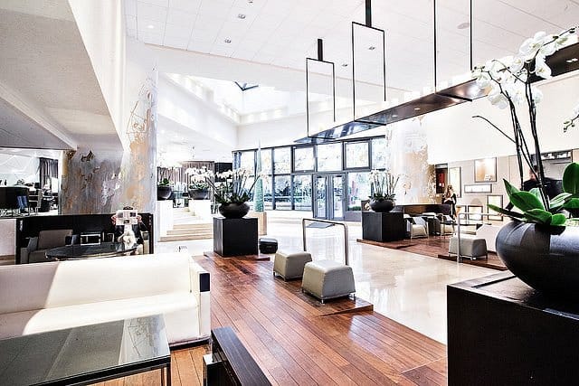 Upscale Novotel Paris Les Halles lobby with natural light for corporate event registration.