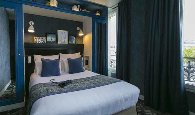 Stylish boutique hotel room near Arc de Triomphe for business travel.
