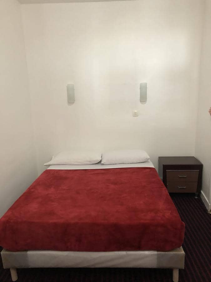 Budget hotel room at Hotel Chevallier, simple guest accommodation for travel and lodging.