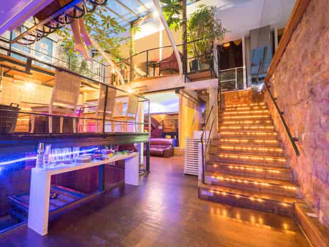 Industrial chic Loft venue with dramatic staircase for evening receptions and brand activations.
