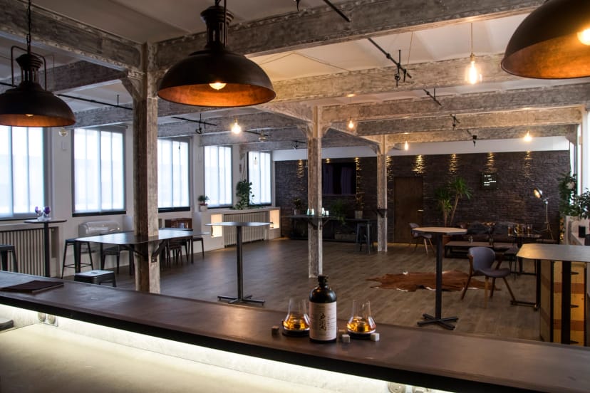 Industrial-chic Sub-committee Room at The Loft with integrated bar for networking reception events.