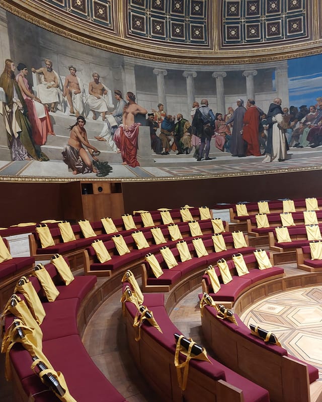 Amphithéâtre d'honneur at Beaux-Arts de Paris with yellow seats for plenary sessions and events.