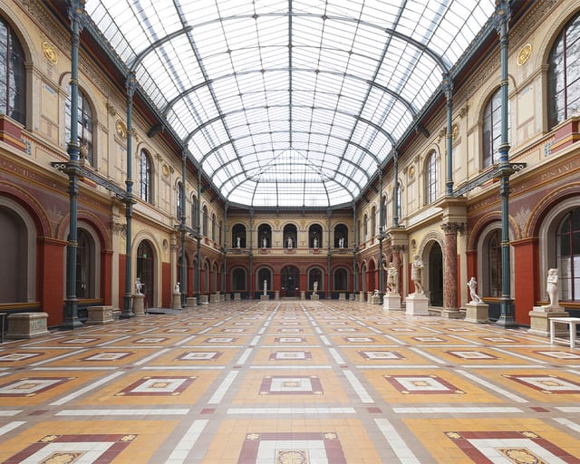 Cour vitrée at Beaux-Arts de Paris: grand gala venue with dramatic glass ceiling.