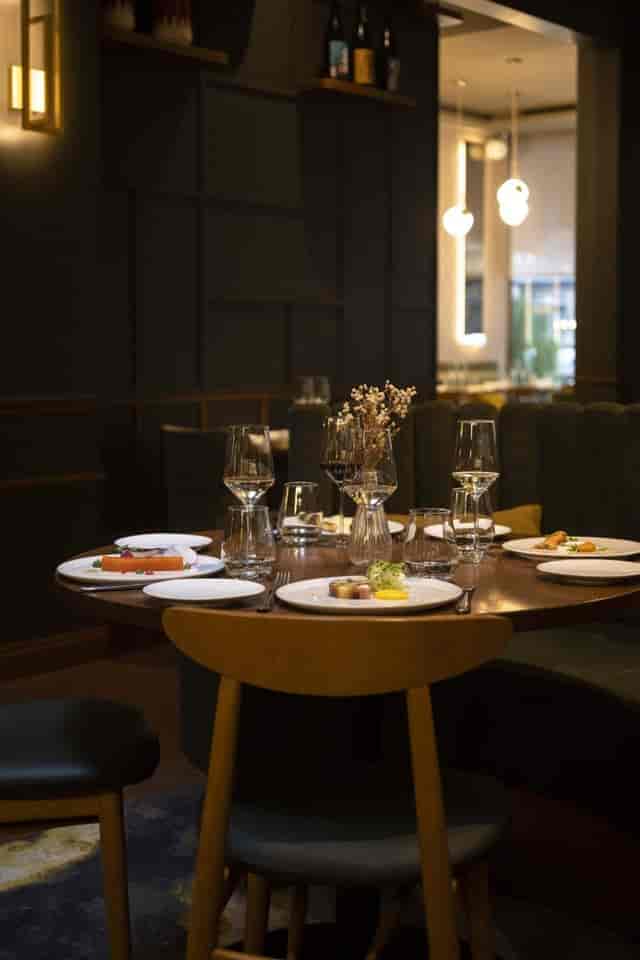 Intimate Sphere lounge dining table for VIP corporate networking events.