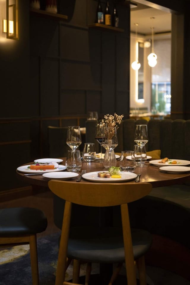 Intimate Sphere lounge dining table for VIP corporate networking events.