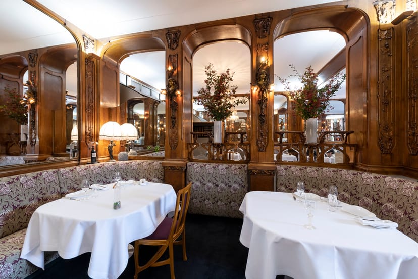 High-end private dining room at Lucas Carton, ideal for formal business networking and gala dinners.