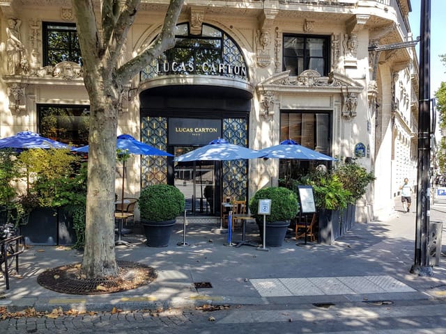 Elegant Lucas Carton sidewalk terrace for luxury VIP networking and upscale brand events.