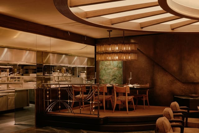 Private dining at La Table du Chef: elegant tiered seating for exclusive events and gala dinners.
