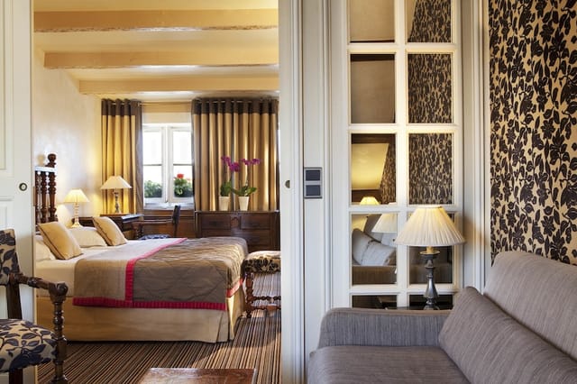 Luxury hotel suite lounge in Paris for VIP executive meetings and corporate travel.