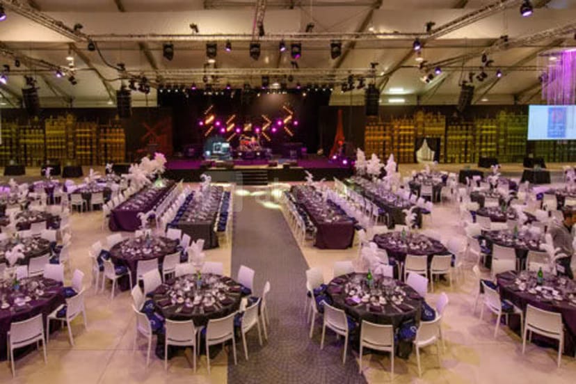 Gala setup at LE Hall Paris: runway, banquet seating, AV truss, event venue.