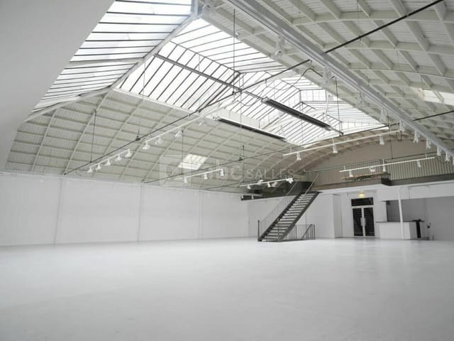 Industrial-chic Espace Commines venue with skylights for brand activations and product launches.