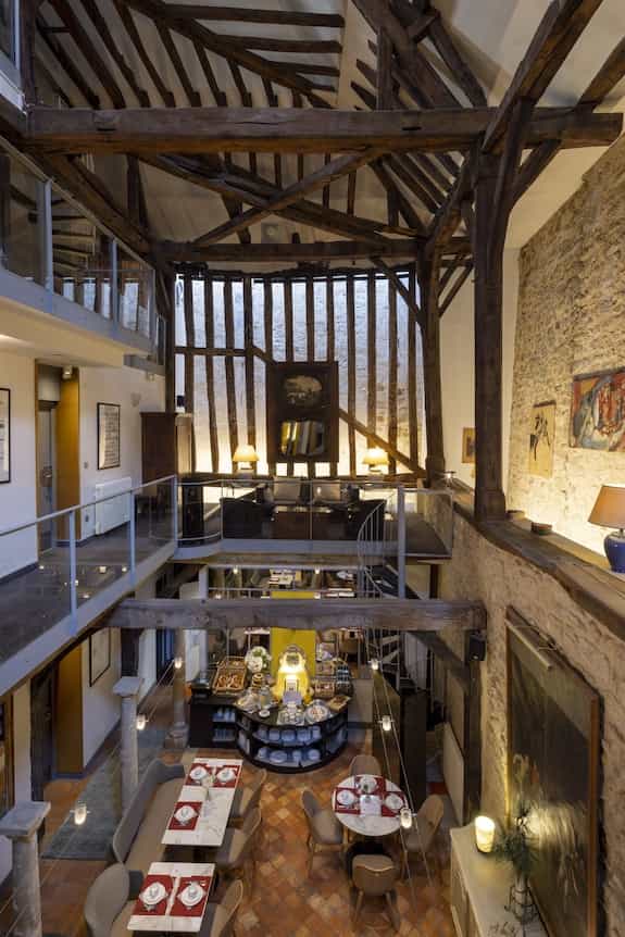 Boutique suite with timber framing and stone walls for intimate event or VIP networking reception.